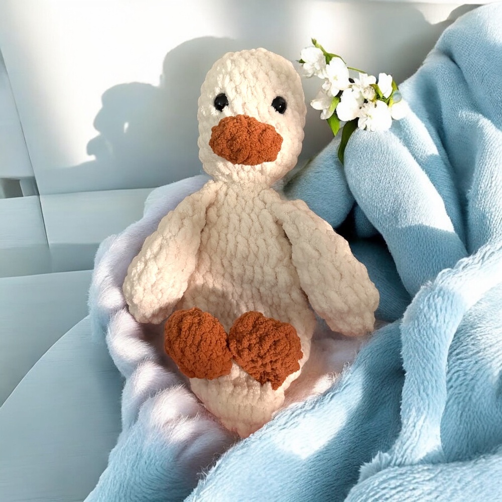 Handmade crochet duck lovey – soft, cuddly plush toy.